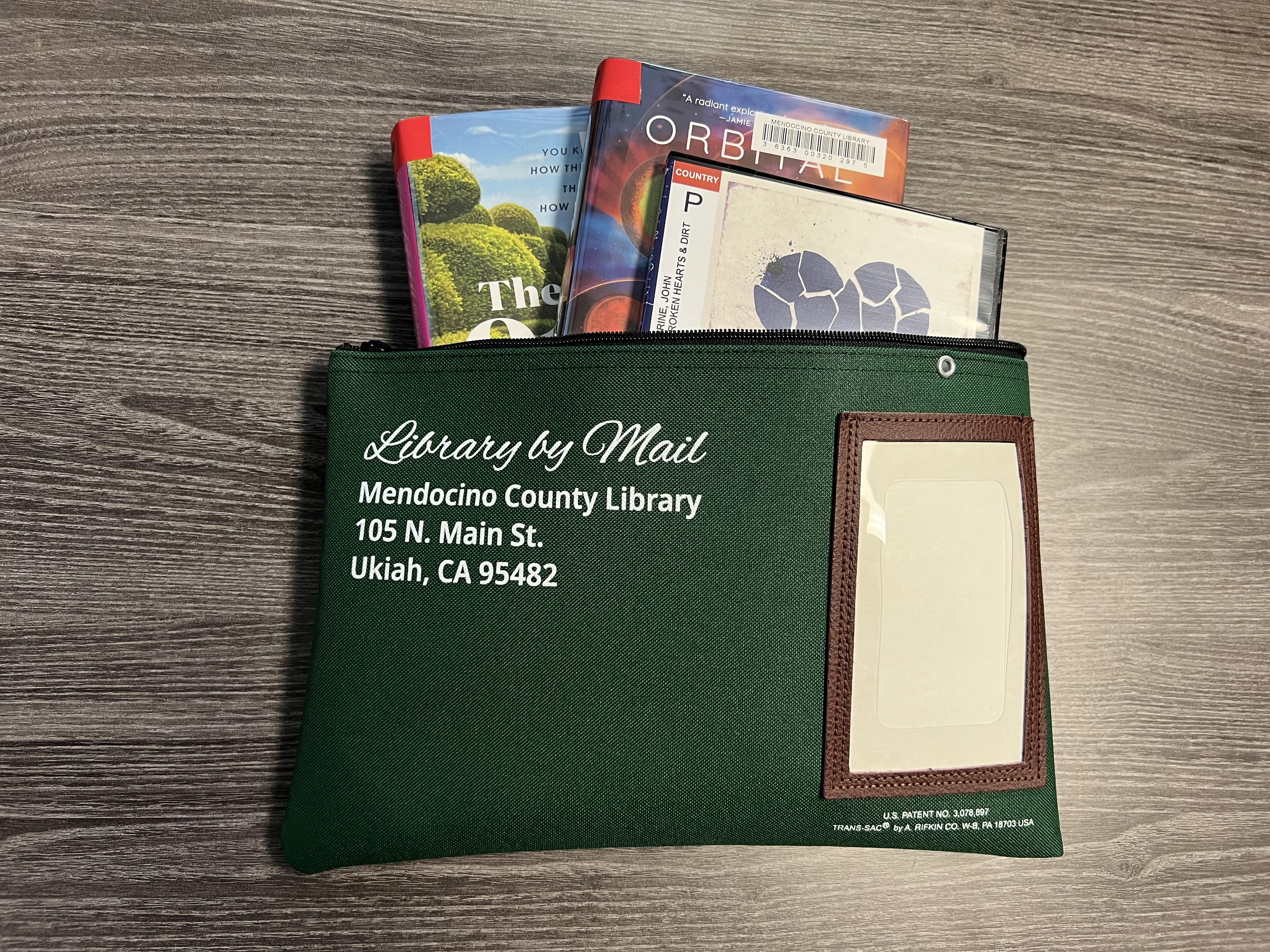 Mail bag of library items.