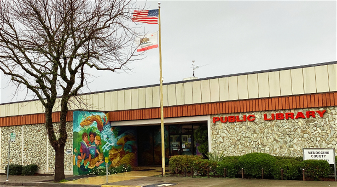 Ukiah Library exterior with tree and flagpole.