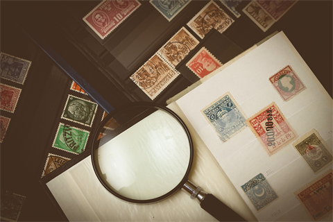 Stamps and a Magnifying glass