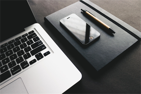 picture of laptop and phone on table